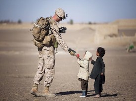 A Soldier passing out candy
