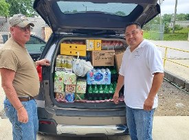 Charlie helping Carlos' ministry with a load of drinks and non-perishable food items 