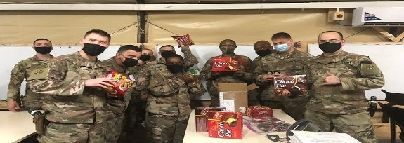 Soldiers in Afghanistan with the boxes of goodies from HHOOT's Distribution Center that Helping Heroes of America sent to them. Soldiers in Afghanistan with the boxes of goodies from HHOOT's Distribution Center that Helping Heroes of America sent to them.