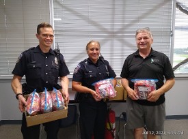 Jack Williams with Changing Footprints and IMPD NW District Officers receiving donated (from HDC) emergency food packs for their squad cards to help those in need Jack Williams with Changing Footprints and IMPD NW District Officers receiving donated (from HDC) emergency food packs for their squad cards to help those in need